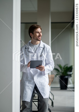 Young physician happy reviewing medical card Young physician happy reviewing medical card 133300678