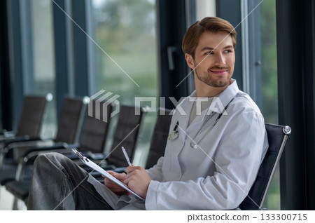 Medical professional doing paperwork in hospital interior 133300715