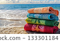 Christmas-themed beach towels, ocean view, festive colors . 133301184