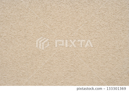 Background texture of uneven ochre-colored exterior wall with lysine finish 133301369