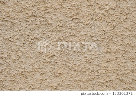 Background texture of uneven ochre-colored exterior wall with lysine finish Background texture of uneven ochre-colored exterior wall with lysine finish 133301371