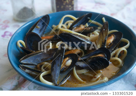 pasta with mussels in blue bowl traditional italian seafood dish pasta with mussels in blue bowl traditional italian seafood dish 133301520