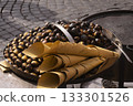 roasted chestnuts next to paper cones at street food stand on cobblestones street 133301526