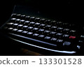 vintage dusty typewriter keyboard in dramatic dark atmospheric lighting 133301528
