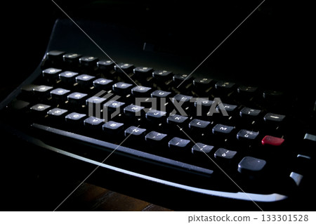 vintage dusty typewriter keyboard in dramatic dark atmospheric lighting vintage dusty typewriter keyboard in dramatic dark atmospheric lighting 133301528