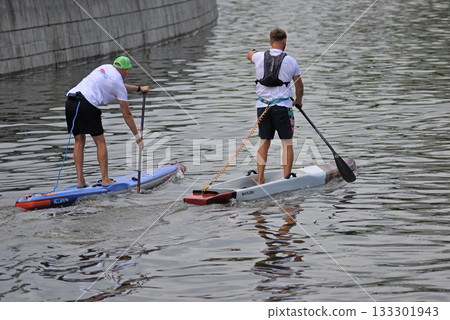 Sup surfing, two athletes 133301943