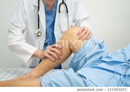 Doctor checking Asian elderly woman patient with scar knee replacement surgery in hospital. Doctor checking Asian elderly woman patient with scar knee replacement surgery in hospital. 133303051