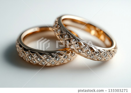 Pair of white gold wedding rings on a white background. Pair of white gold wedding rings on a white background. 133303271