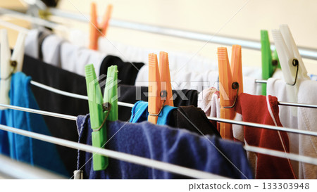 Colorful Clothes Drying on Rack Colorful Clothes Drying on Rack 133303948