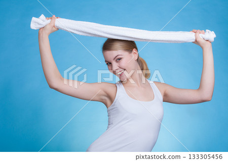 Woman with a towel above her head 133305456