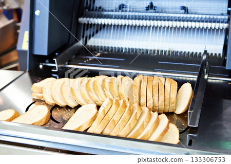 Sliced bread in cutting machine Sliced bread in cutting machine 133306753