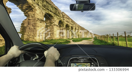 Driving past the ancient Roman Aqueduct Park in Italy 133306994