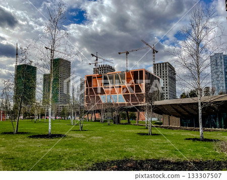 cityscape transforming with new green spaces, development and greenery harmonize in city expansion cityscape transforming with new green spaces, development and greenery harmonize in city expansion 133307507