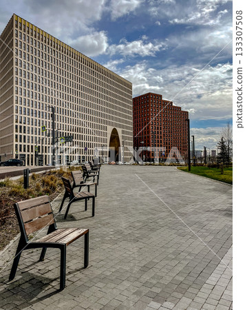 urban tranquil setting, quiet outdoor area adjacent to sleek glass architecture with inviting seating urban tranquil setting, quiet outdoor area adjacent to sleek glass architecture with inviting seating 133307508