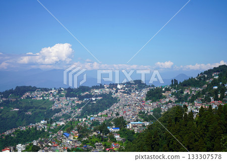 Panoramic View of the Crowded Hill Station Town of Darjeeling with Himalayan Peaks 133307578