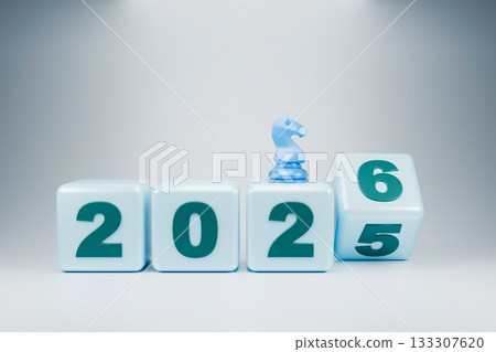 The wooden blocks display the year 2025-2026, with a small chess piece The wooden blocks display the year 2025-2026, with a small chess piece 133307620