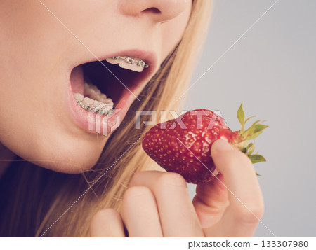 Young woman with fresh strawberries Young woman with fresh strawberries 133307980