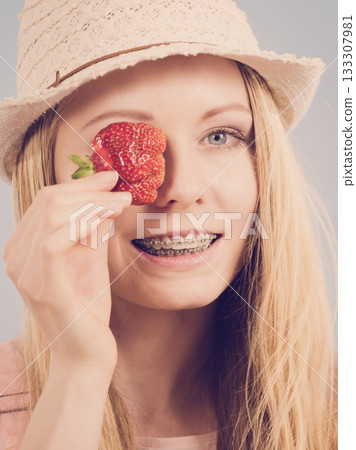 Young woman with fresh strawberries Young woman with fresh strawberries 133307981
