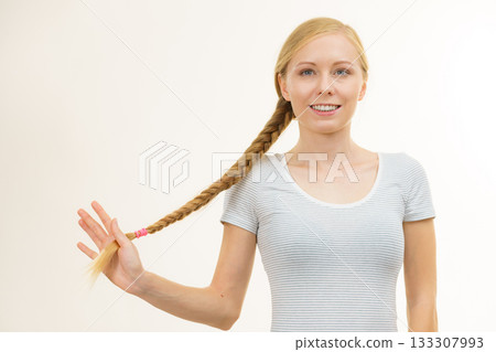 Blonde young woman with braid hair 133307993