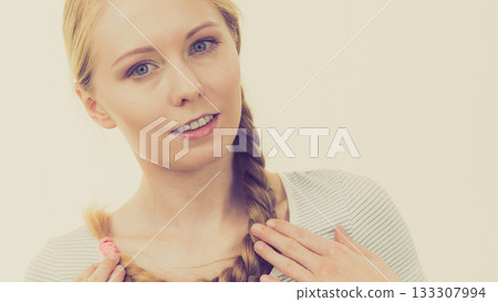 Blonde girl with long braid hair Blonde girl with long braid hair 133307994