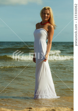 Beautiful blonde girl on beach, summertime Beautiful blonde girl on beach, summertime 133308062
