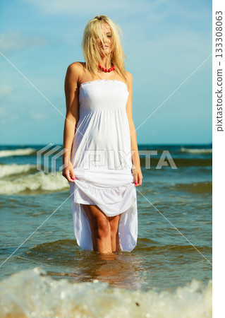 Young woman chilling out on the beach. Young woman chilling out on the beach. 133308063