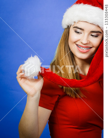 Positive woman wearing Santa Claus helper costume Positive woman wearing Santa Claus helper costume 133308448