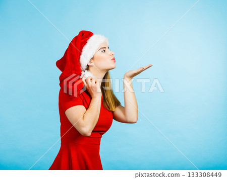 Woman christmas costume sending kisses 133308449
