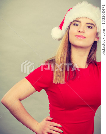 Woman wearing Santa Claus helper costume Woman wearing Santa Claus helper costume 133308471