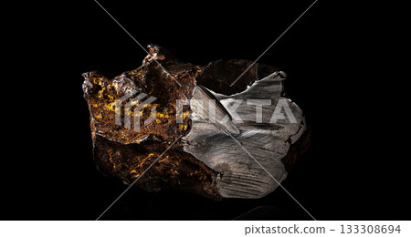 Chondrite Meteorite L Type isolated, piece of rock formed in outer space in the early stages of Solar System as asteroids. This meteorite comes from a meteorite fall impacting Earth 133308694