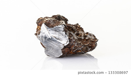 Chondrite Meteorite L Type isolated, piece of rock formed in outer space in the early stages of Solar System as asteroids. This meteorite comes from a meteorite fall impacting Earth 133308697