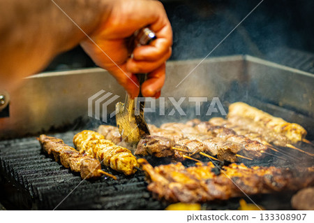 Grilled Kebab From Fresh Meat Pork Cooking On Metal Skewer Outdoors grill steak Grilled Kebab From Fresh Meat Pork Cooking On Metal Skewer Outdoors grill steak 133308907