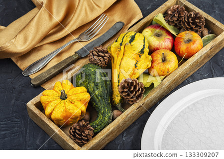 Apples and pumpkins with autumn leaves. 133309207