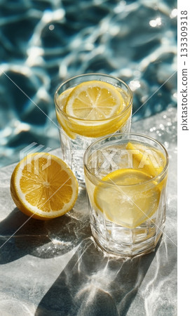 Refreshing Lemon Drinks by the Poolside on a Sunny Day Refreshing Lemon Drinks by the Poolside on a Sunny Day 133309318