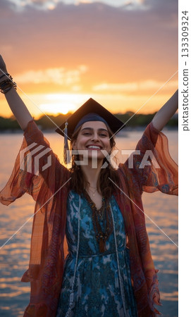 Celebration at Sunset as a Young Woman Graduates by the Water 133309324