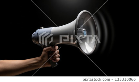 A hand holding a megaphone with a sound wave on black, perfect for announcement graphics, protest themes, and loud communication concepts. 133310066