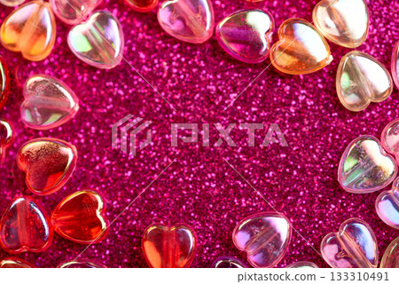 Border from Translucent Heart-Shaped Capsules on Glittery Pink Background for Valentines Day Celebration Border from Translucent Heart-Shaped Capsules on Glittery Pink Background for Valentines Day Celebration 133310491