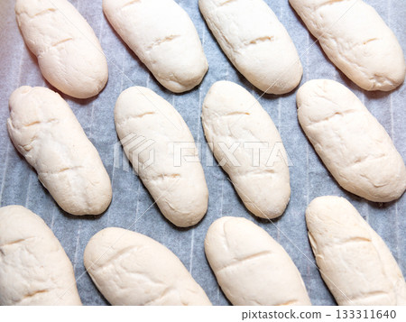 Baked goods, homemade bread dough before baking. Baked goods, homemade bread dough before baking. 133311640