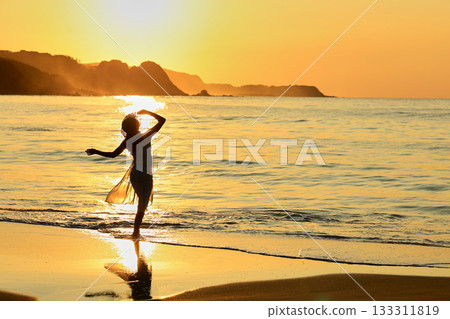 Sunset over the sea and her 133311819