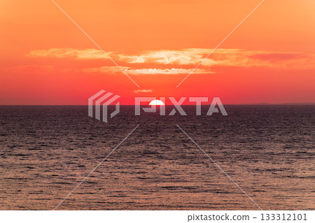Beautiful red and orange sunrise over the sea. Beautiful red and orange sunrise over the sea. 133312101