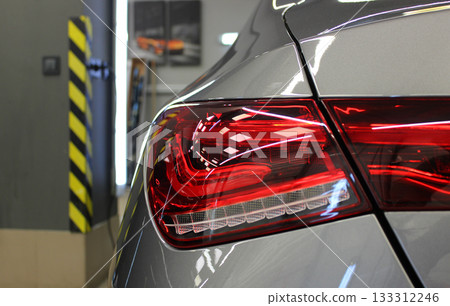 Original design of a rear light with LED elements of a car in underground garage Original design of a rear light with LED elements of a car in underground garage 133312246