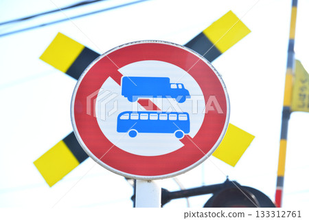 No large freight vehicles allowed. Road sign. Railroad crossing sign. No large freight vehicles allowed. Road sign. Railroad crossing sign. 133312761