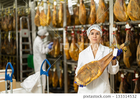 Adult female specialist working in a jamon factory 133314532