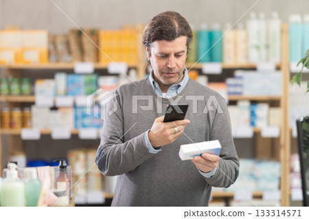 Adult man scanning qr code of ointment 133314571