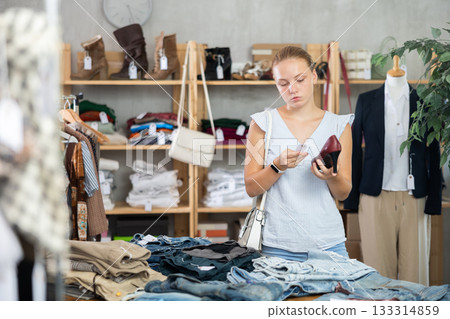 Woman choosing shoes in the store 133314859