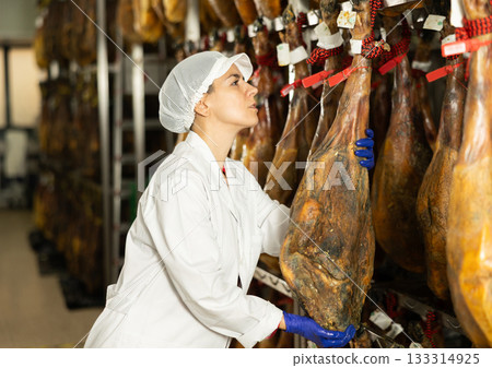 woman factory worker checks the jamon 133314925