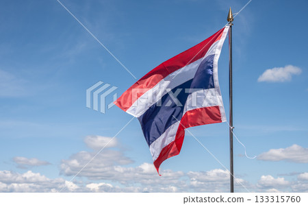 A Thailand national flag blowing by wind against blue sky. The flag of Thailand is a symbol of being a country. A Thailand national flag blowing by wind against blue sky. The flag of Thailand is a symbol of being a country. 133315760