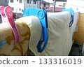 On a nice, sunny morning, hang your futon out on the balcony and make sure to secure it with futon clips. 133316019