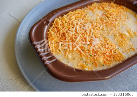 A close-up photo of a commercially available gratin before heating it in the microwave. A close-up photo of a commercially available gratin before heating it in the microwave. 133316063