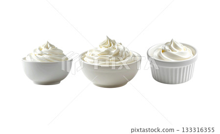 Whipped cream on a coffee cup is a sweet breakfast dessert with white milk isolated on the background. Whipped cream on a coffee cup is a sweet breakfast dessert with white milk isolated on the background. 133316355